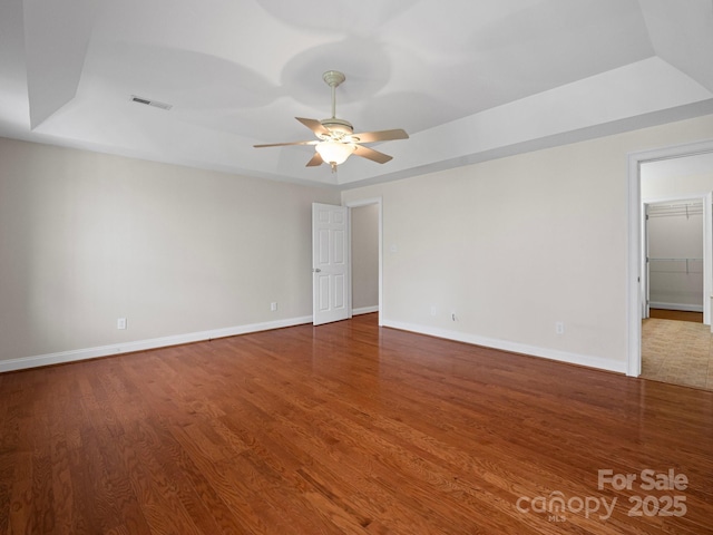 2872 Wheat Field Ct, Lincolnton, NC 28092 - spare room with ceiling fan, wood finished floors, and a tray ceiling