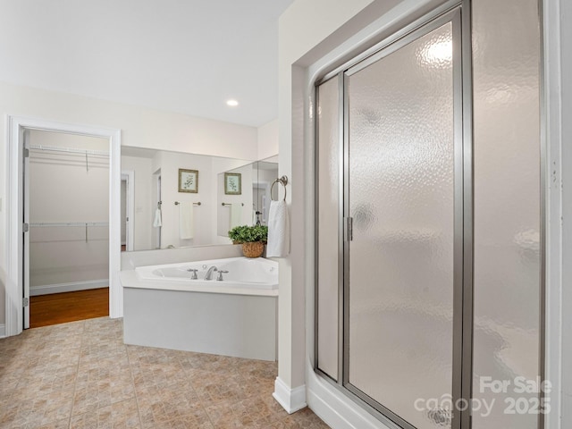 2872 Wheat Field Ct, Lincolnton, NC 28092 - full bathroom featuring a shower stall, a bath, and a walk in closet