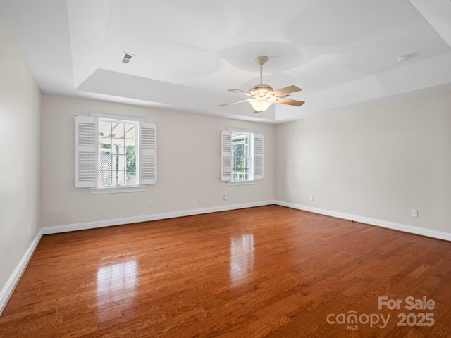2872 Wheat Field Ct, Lincolnton, NC 28092 - unfurnished room featuring a raised ceiling, wood finished floors, and ceiling fan