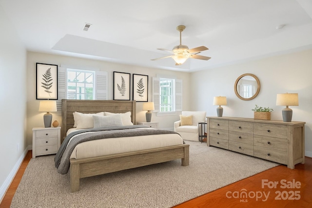 2872 Wheat Field Ct, Lincolnton, NC 28092 - bedroom with multiple windows, wood finished floors, and ceiling fan