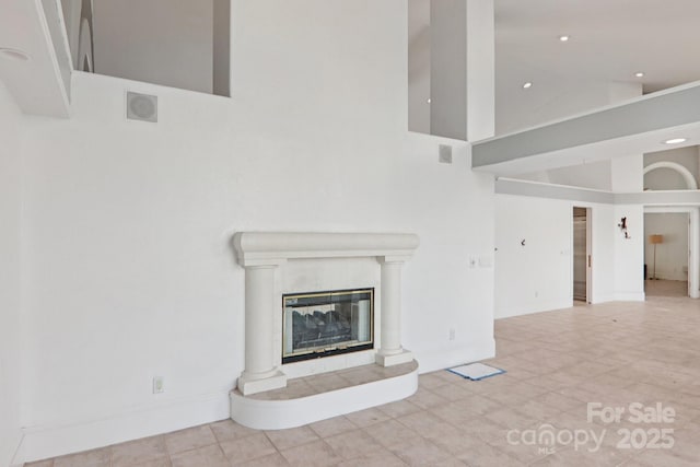 69 Sprouse Town Rd, Weaverville, NC 28787 - unfurnished living room with high vaulted ceiling, a fireplace, and recessed lighting