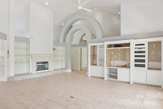 69 Sprouse Town Rd, Weaverville, NC 28787 - unfurnished living room with built in shelves, a ceiling fan, recessed lighting, light tile patterned floors, and a fireplace