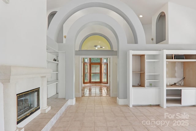 69 Sprouse Town Rd, Weaverville, NC 28787 - foyer entrance featuring a ceiling fan, tile patterned flooring, a tile fireplace, and high vaulted ceiling