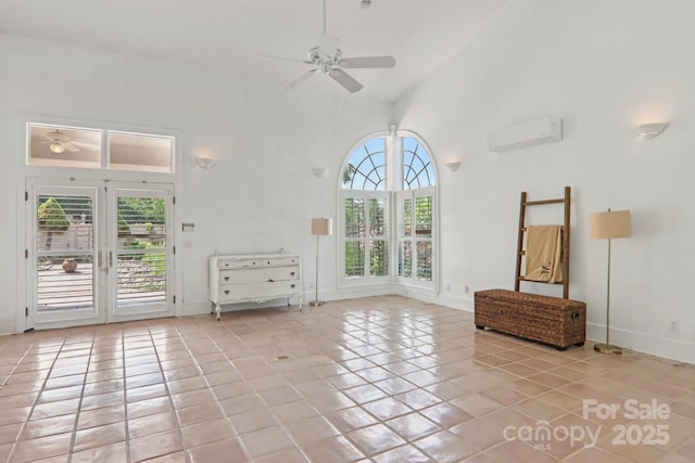 69 Sprouse Town Rd, Weaverville, NC 28787 - unfurnished living room featuring ceiling fan, healthy amount of natural light, tile patterned flooring, an AC wall unit, and high vaulted ceiling
