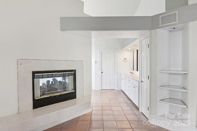 69 Sprouse Town Rd, Weaverville, NC 28787 - bathroom with vanity, tile patterned floors, and a tiled fireplace