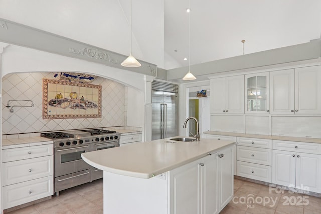 69 Sprouse Town Rd, Weaverville, NC 28787 - kitchen featuring high quality appliances, light countertops, backsplash, and high vaulted ceiling