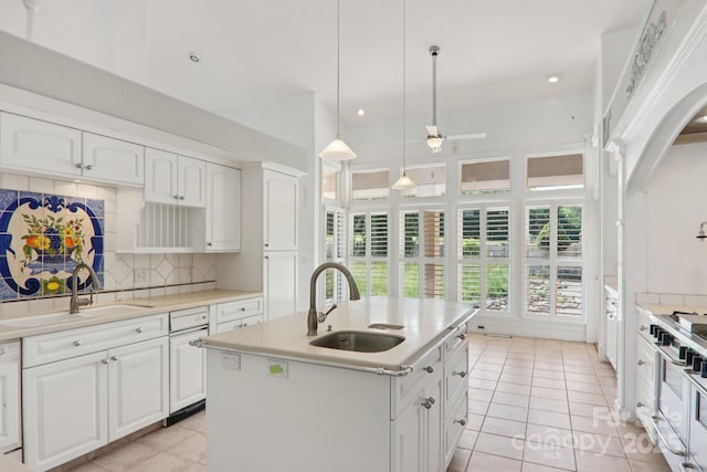 69 Sprouse Town Rd, Weaverville, NC 28787 - kitchen featuring light tile patterned floors, double oven range, backsplash, white cabinetry, and recessed lighting