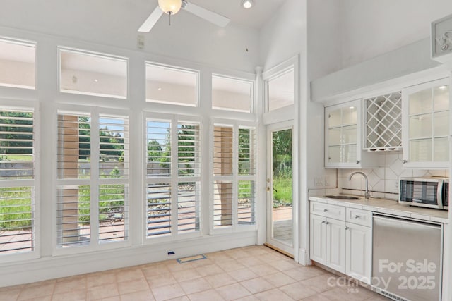 69 Sprouse Town Rd, Weaverville, NC 28787 - kitchen with appliances with stainless steel finishes, tile countertops, a ceiling fan, light tile patterned floors, and white cabinetry