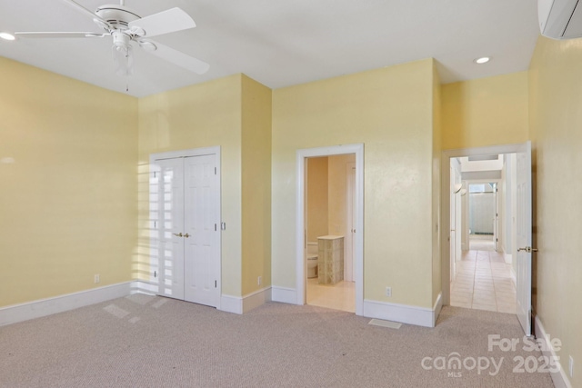 69 Sprouse Town Rd, Weaverville, NC 28787 - unfurnished bedroom with a wall mounted air conditioner, carpet flooring, connected bathroom, a closet, and recessed lighting