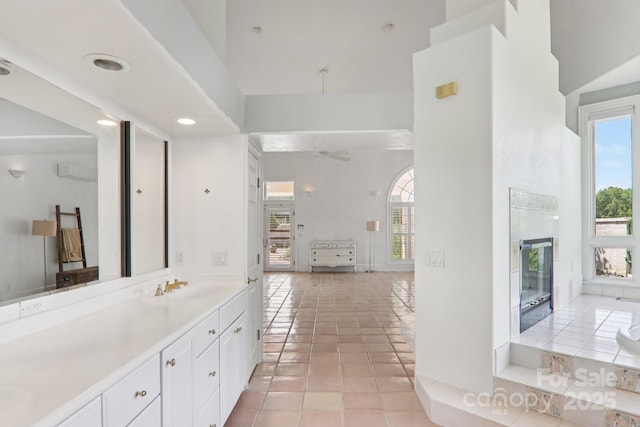 69 Sprouse Town Rd, Weaverville, NC 28787 - bathroom featuring a towering ceiling, a ceiling fan, vanity, tile patterned floors, and recessed lighting