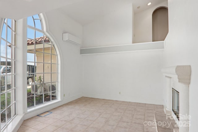 69 Sprouse Town Rd, Weaverville, NC 28787 - unfurnished room featuring an AC wall unit, a fireplace, tile patterned flooring, and recessed lighting