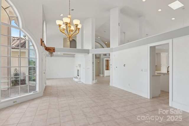 69 Sprouse Town Rd, Weaverville, NC 28787 - unfurnished living room with high vaulted ceiling, a chandelier, recessed lighting, and a skylight