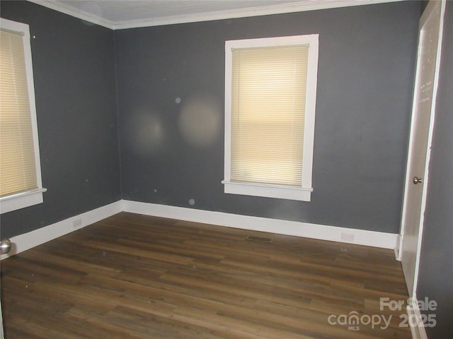 1110 20th St NE, Hickory, NC 28601 - empty room featuring dark wood-type flooring and crown molding