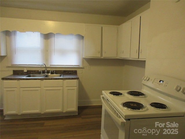 1110 20th St NE, Hickory, NC 28601 - kitchen with electric range, dark wood-type flooring, white cabinetry, and dark countertops