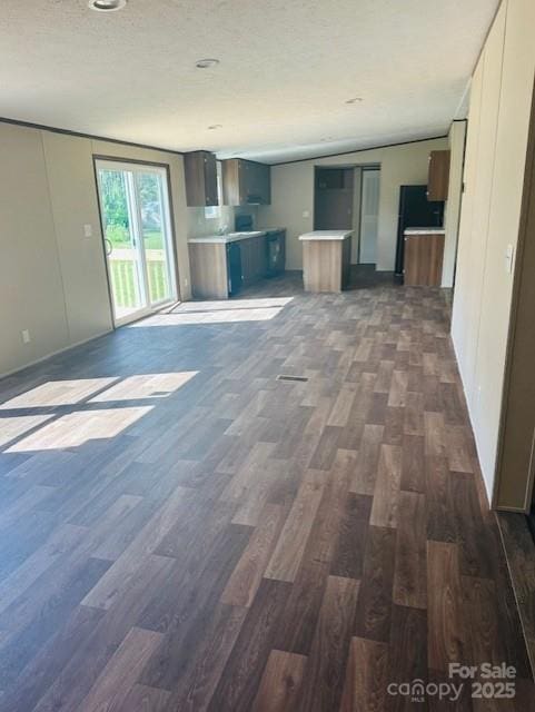 3577 Ken Mcentire Rd, Lawndale, NC 28090 - unfurnished living room with dark wood finished floors and a textured ceiling