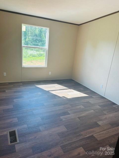 3577 Ken Mcentire Rd, Lawndale, NC 28090 - empty room with crown molding and wood finished floors