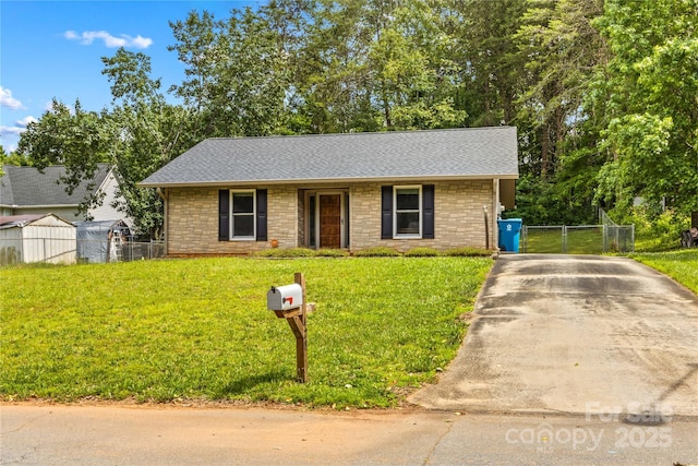 428 Mountview Dr, Mocksville, NC 27028 - view of front facade featuring stone siding, a gate, a shingled roof, and driveway