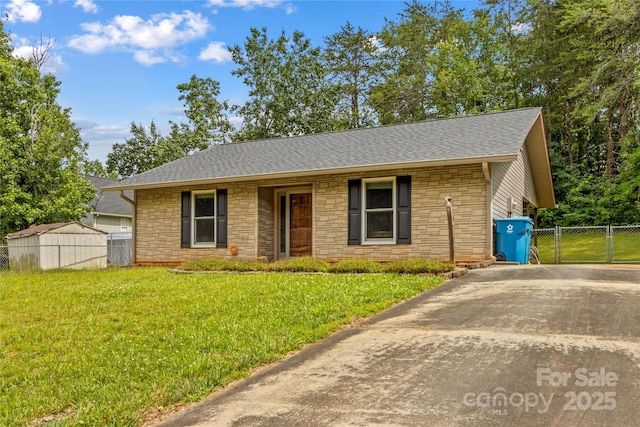 428 Mountview Dr, Mocksville, NC 27028 - ranch-style home featuring stone siding, roof with shingles, concrete driveway, and a gate