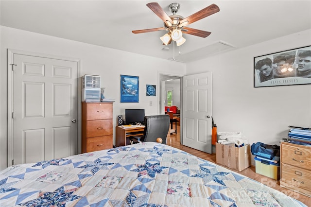 428 Mountview Dr, Mocksville, NC 27028 - bedroom featuring attic access, wood finished floors, a ceiling fan, and a desk