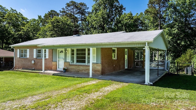 917 Sunset Ave SW, Valdese, NC 28690 - ranch-style house featuring an attached carport, driveway, and brick siding