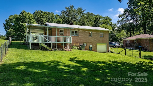 917 Sunset Ave SW, Valdese, NC 28690 - rear view of property with stairs, a garage, a wooden deck, and a gate