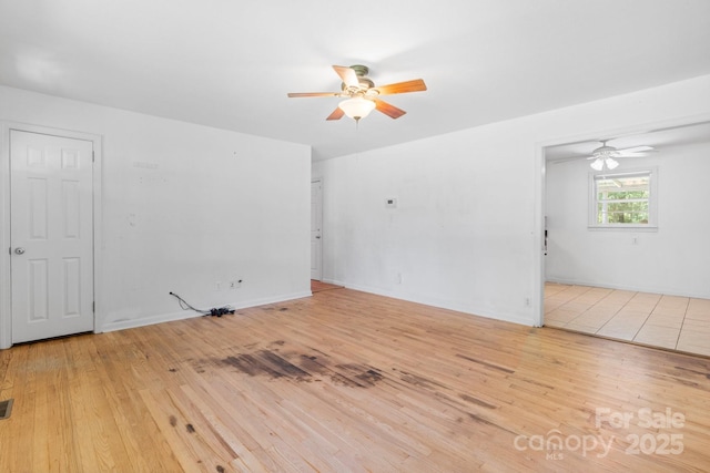 917 Sunset Ave SW, Valdese, NC 28690 - unfurnished room featuring a ceiling fan and hardwood / wood-style floors