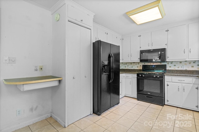 917 Sunset Ave SW, Valdese, NC 28690 - kitchen with black appliances, light tile patterned floors, white cabinets, and dark countertops