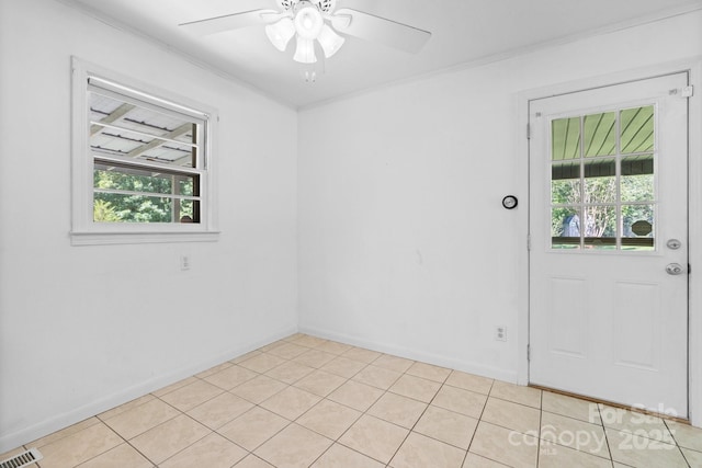 917 Sunset Ave SW, Valdese, NC 28690 - spare room featuring a ceiling fan, ornamental molding, and light tile patterned floors