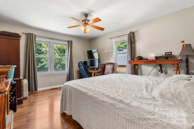 4006 Sol Mull St, Morganton, NC 28655 - bedroom with wood finished floors and a ceiling fan