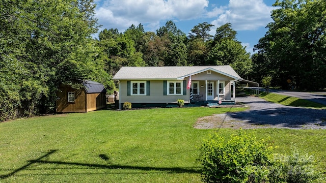 4006 Sol Mull St, Morganton, NC 28655 - view of front of property featuring a storage shed, a front yard, covered porch, and crawl space