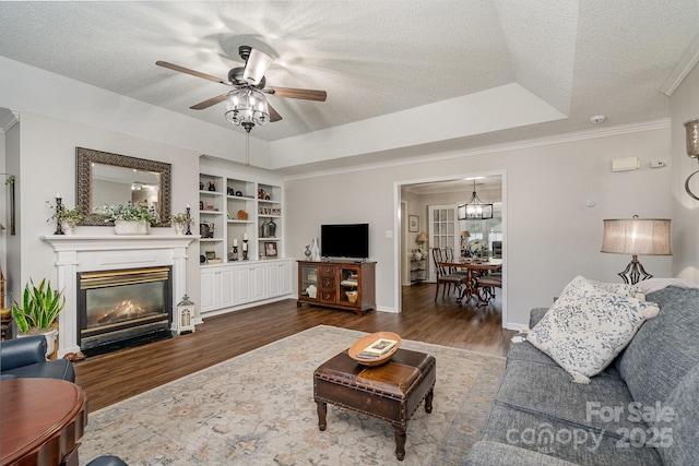 1610 Union Rd Unit 1610B, Gastonia, NC 28054 - living room with dark wood-type flooring, a textured ceiling, ceiling fan, a glass covered fireplace, and crown molding