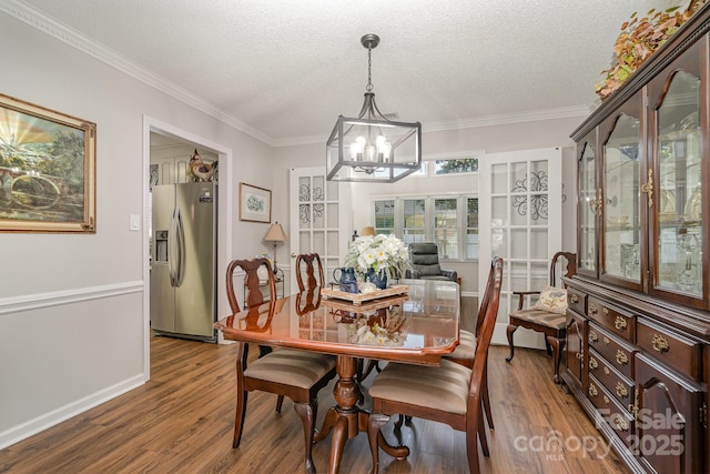 1610 Union Rd Unit 1610B, Gastonia, NC 28054 - dining space featuring a chandelier, wood finished floors, ornamental molding, and a textured ceiling