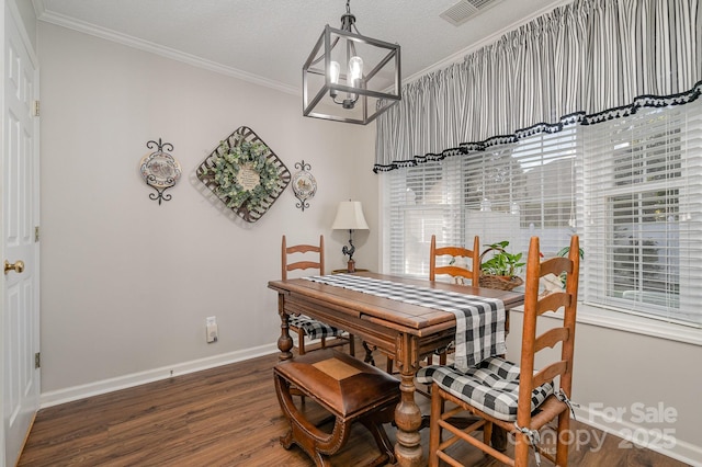 1610 Union Rd Unit 1610B, Gastonia, NC 28054 - dining room with wood finished floors, a chandelier, ornamental molding, and healthy amount of natural light
