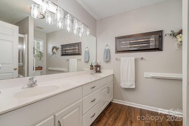 1610 Union Rd Unit 1610B, Gastonia, NC 28054 - bathroom with double vanity, wood finished floors, and a shower with shower door