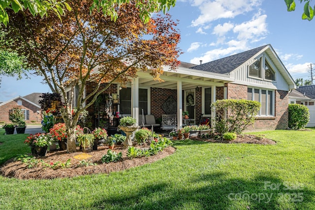 1610 Union Rd Unit 1610B, Gastonia, NC 28054 - view of front of house featuring brick siding, a front lawn, a porch, and a shingled roof