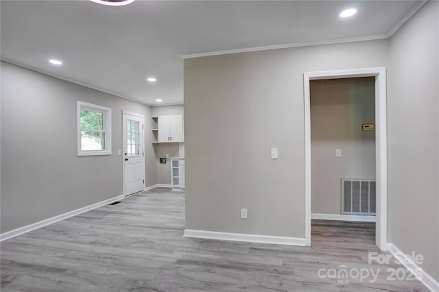9763 Pine Tree Rd, Norwood, NC 28128 - empty room featuring light wood-style flooring, crown molding, and recessed lighting