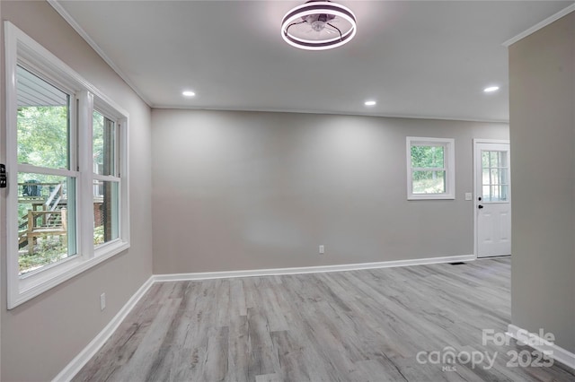 9763 Pine Tree Rd, Norwood, NC 28128 - spare room with plenty of natural light, wood finished floors, ornamental molding, and recessed lighting