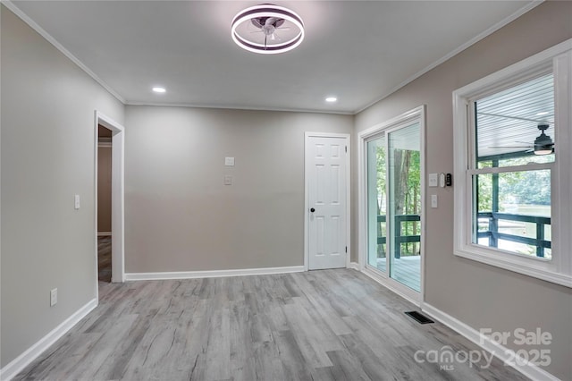 9763 Pine Tree Rd, Norwood, NC 28128 - foyer entrance featuring ornamental molding, light wood-style floors, and recessed lighting