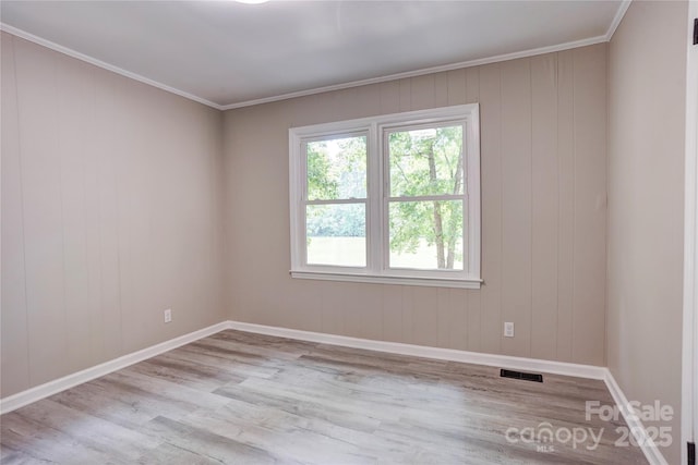 9763 Pine Tree Rd, Norwood, NC 28128 - spare room featuring wood finished floors and crown molding