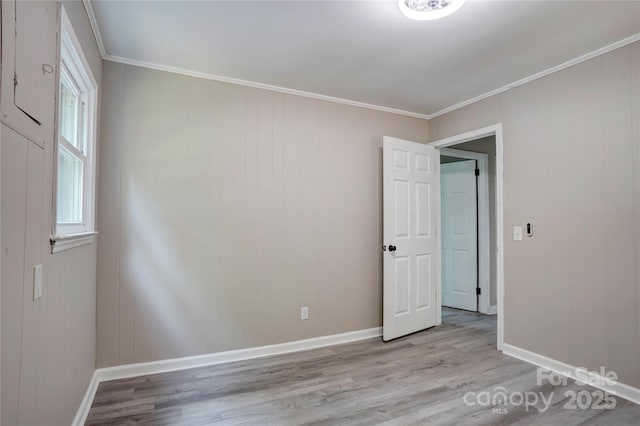 9763 Pine Tree Rd, Norwood, NC 28128 - unfurnished room featuring light wood-style flooring and ornamental molding
