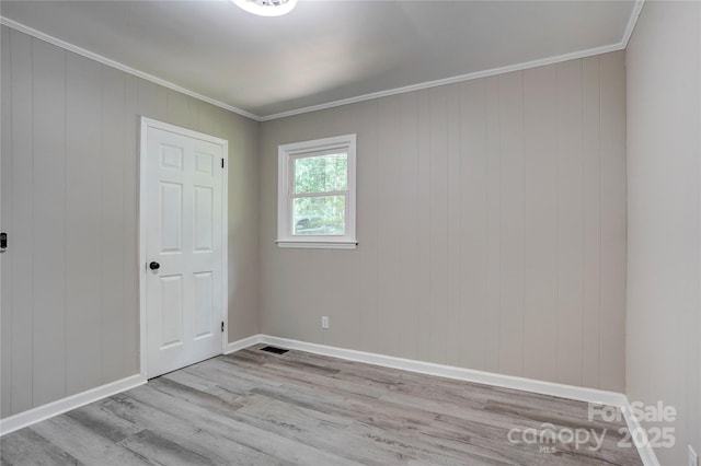 9763 Pine Tree Rd, Norwood, NC 28128 - empty room with wood finished floors and crown molding