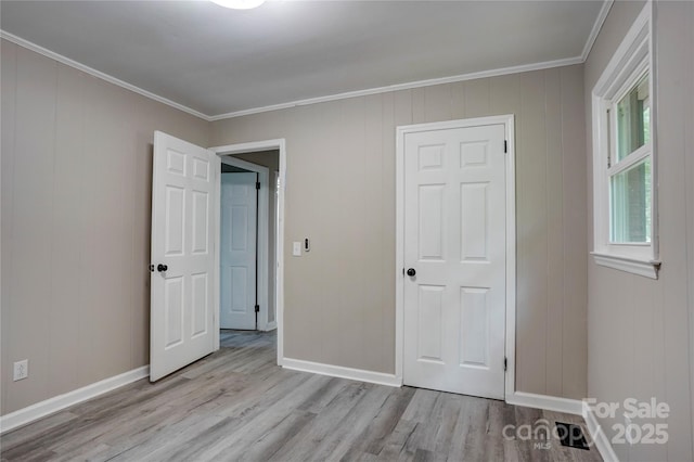 9763 Pine Tree Rd, Norwood, NC 28128 - unfurnished bedroom featuring wood finished floors and ornamental molding