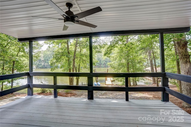 9763 Pine Tree Rd, Norwood, NC 28128 - unfurnished sunroom featuring ceiling fan and view of wooded area