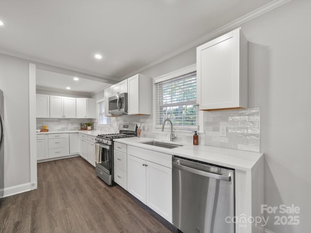 6401 Montpelier Rd, Charlotte, NC 28210 - kitchen with appliances with stainless steel finishes, recessed lighting, tasteful backsplash, crown molding, and dark wood-type flooring