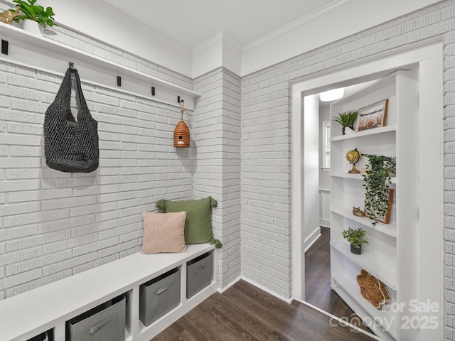 6401 Montpelier Rd, Charlotte, NC 28210 - mudroom with dark wood finished floors, ornamental molding, and brick wall