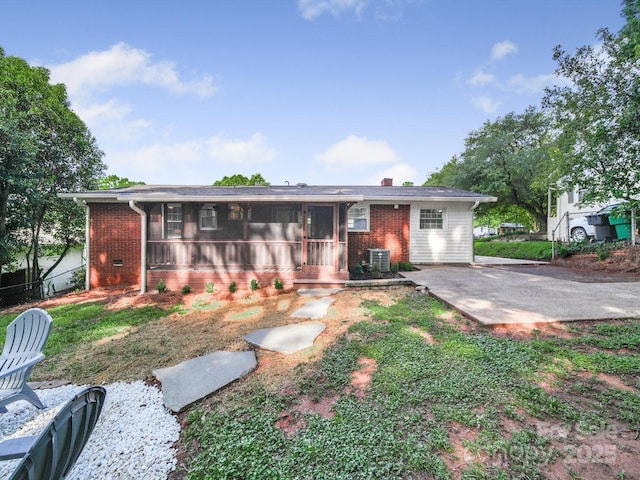 6401 Montpelier Rd, Charlotte, NC 28210 - rear view of property featuring brick siding and a sunroom