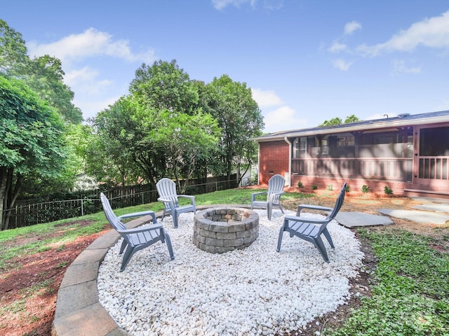 6401 Montpelier Rd, Charlotte, NC 28210 - view of patio featuring an outdoor fire pit and a sunroom