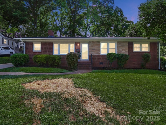 6401 Montpelier Rd, Charlotte, NC 28210 - ranch-style home with a front lawn, brick siding, a chimney, and entry steps