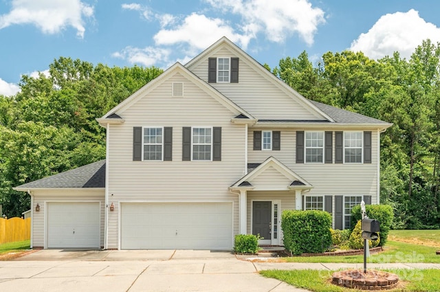 3043 Streamlet Way, Monroe, NC 28110 - traditional home with concrete driveway, a garage, and roof with shingles