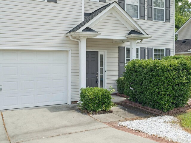 3043 Streamlet Way, Monroe, NC 28110 - doorway to property with driveway and an attached garage